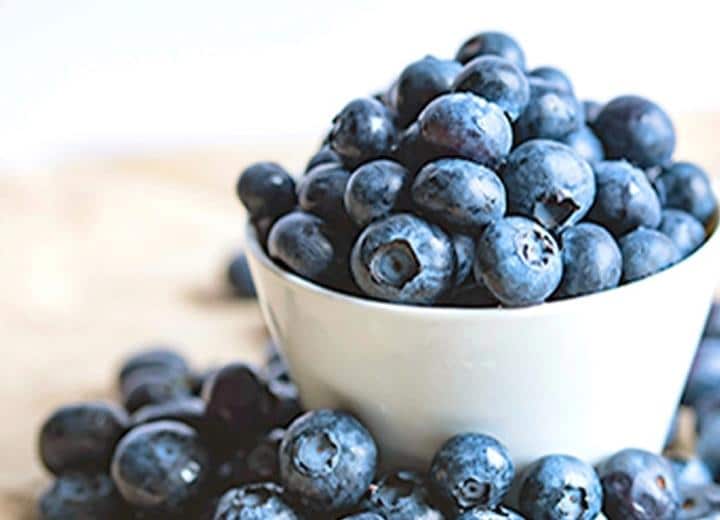 bowl overflowing with blueberries