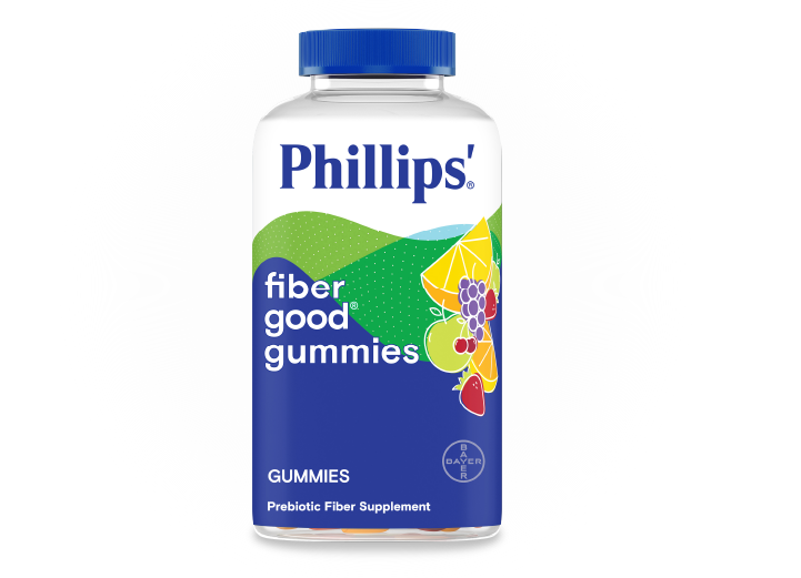 A bottle of Phillips'® fiber good® gummies, and the label features fruit illustrations with text indicating a prebiotic fiber supplement.
